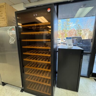 A brand new high-capacity 100-bottle wine cooler and beverage center displayed on the Appliance World showroom floor, highlighting its sleek UV-protected glass door, modern premium trim, elegant pull-out storage shelves, and pristine interior showcase layout, ready for local delivery in Richmond, VA