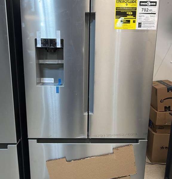 Used Bosch B36FD10ENS/01 French door refrigerator in a stainless steel finish on display at an appliance showroom.