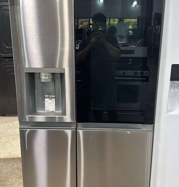 New LG LRSOS2706S side-by-side refrigerator featuring the InstaView glass panel and Craft Ice maker on display.